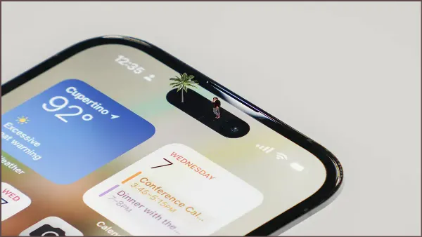 alt: Logo Apple và hình ảnh Dynamic Island trên iPhone 14 Pro
